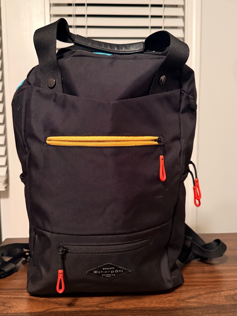 Sherpani Black Backpack with Yellow and Red Accents
